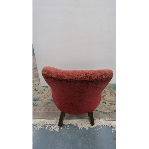 396 - Victorian mahogany armchair upholstered in later red floral fabric, on castors.