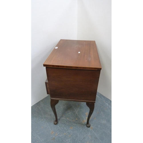 408 - Mahogany two-drawer chest of drawers of small proportions, on cabriole supports and pad feet.