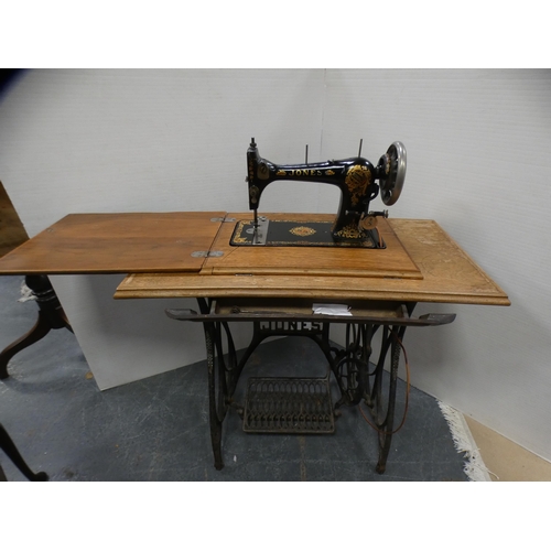 410 - Vintage Jones sewing machine on treadle base.