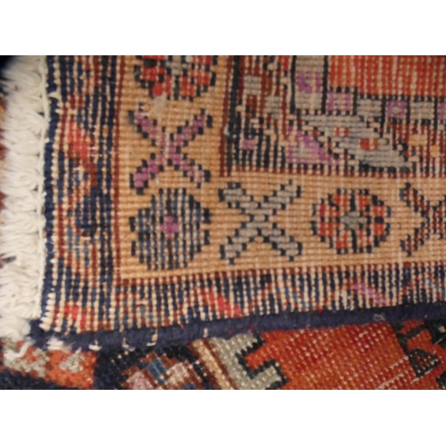 412 - Turkish Heriz-style hand-knotted rug, blue and brown field on red ground.