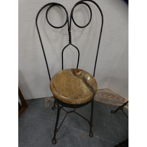 418 - Oak coffee table and a pair of wrought iron and burr kitchen stools.  (3)