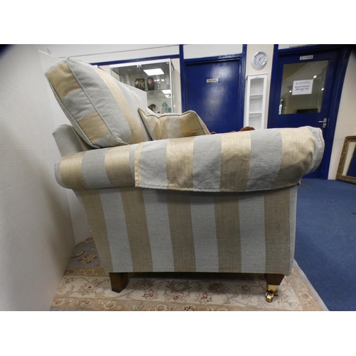 428 - Contemporary two seater sofa with striped upholstery, on brass caps and castors, by Alstons.