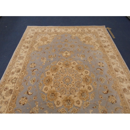 430 - Large Persian design machine-made by Oriental Carpets Limited, with all over floral swags, on blue a... 