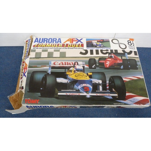 44 - Aurora AFX Formula 1 Duel racing set and a TCR Lighted Jam Car Speedway, both boxed.  (2)