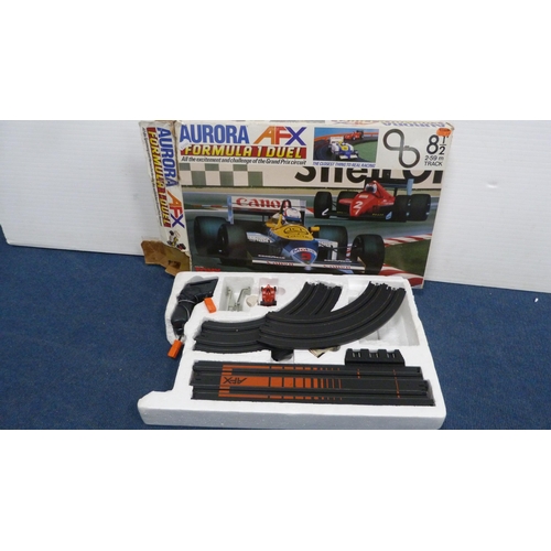 44 - Aurora AFX Formula 1 Duel racing set and a TCR Lighted Jam Car Speedway, both boxed.  (2)