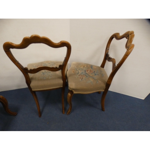 450 - Set of four late Victorian walnut parlour chairs with floral serpentine stuff-over seats, on sabre s... 