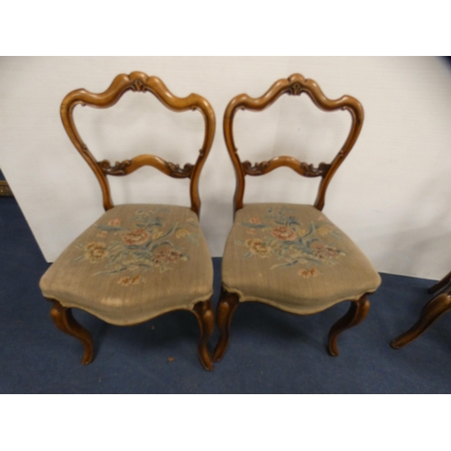 450 - Set of four late Victorian walnut parlour chairs with floral serpentine stuff-over seats, on sabre s... 