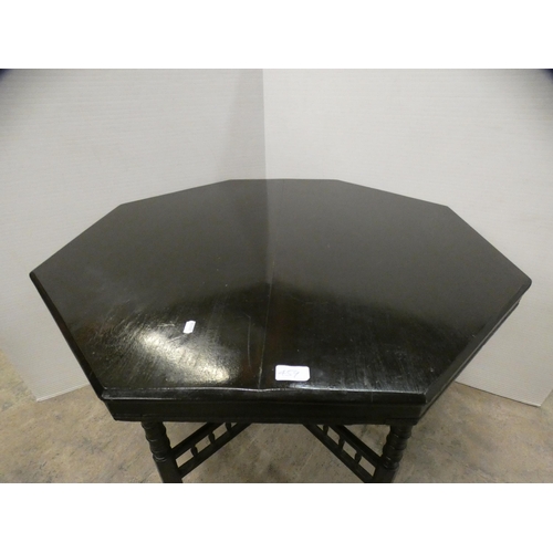 459 - Ebonised octagonal window table, c. early 20th century.