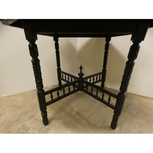 459 - Ebonised octagonal window table, c. early 20th century.