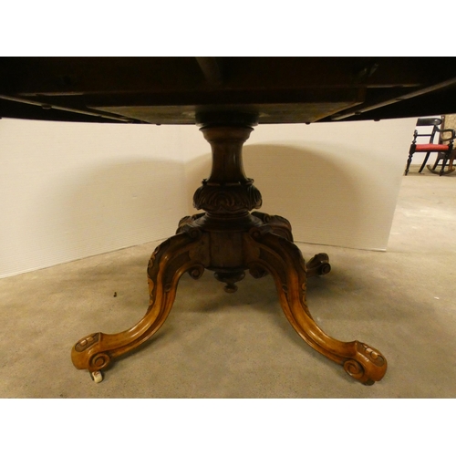 460 - Victorian burr walnut oval breakfast table with snap-action tilt top.