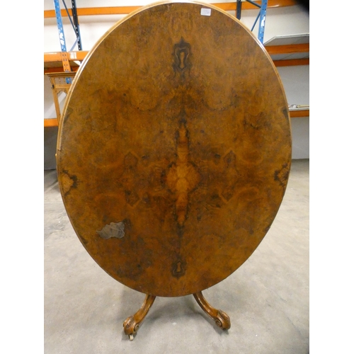 460 - Victorian burr walnut oval breakfast table with snap-action tilt top.