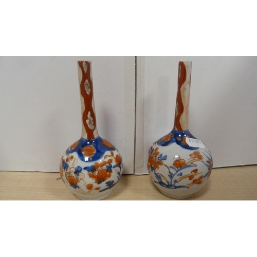 60 - Japanese Imari Meiji period wall plate and a pair of similar Japanese Imari spill vases.  (3)