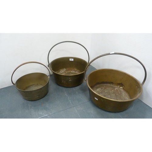 65 - Three graduated brass jelly pans with iron handles.  (3)