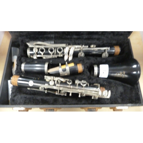 78 - Boosey & Hawkes 'Regent' B flat clarinet with accessories and book, in fitted case.