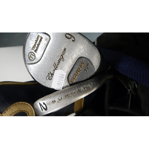 80 - Part set of golf clubs to include examples by Donnay, in a golf bag, also a pair of golf shoes.