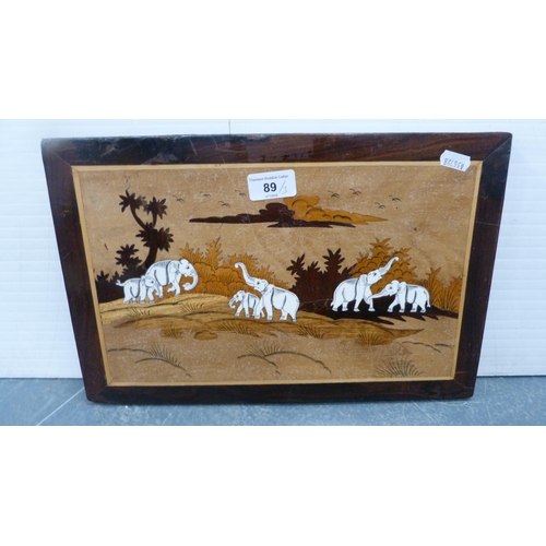 89 - Three Indian hardwood wall panels depicting elephants and horses.  (2)