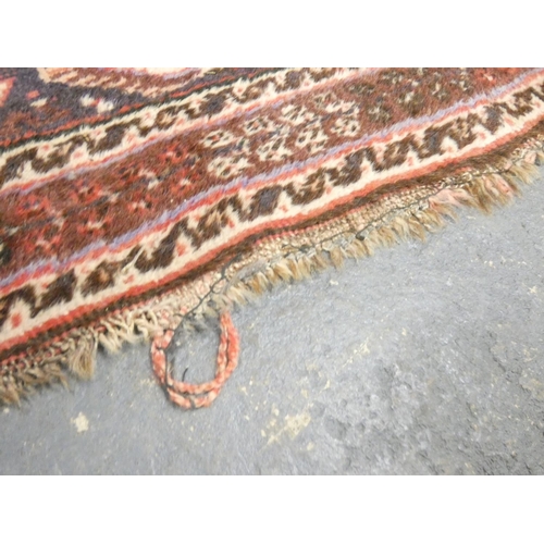 392 - Handmade Iranian red, cream and black rug L172cm x W117cm.