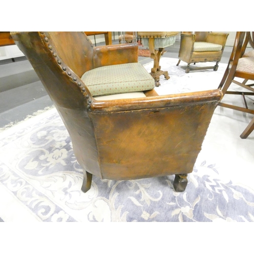 420 - 20th century Arts and Crafts two seater leather sofa along with two leather tub armchairs of studded... 