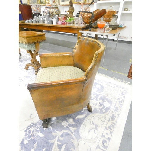 420 - 20th century Arts and Crafts two seater leather sofa along with two leather tub armchairs of studded... 