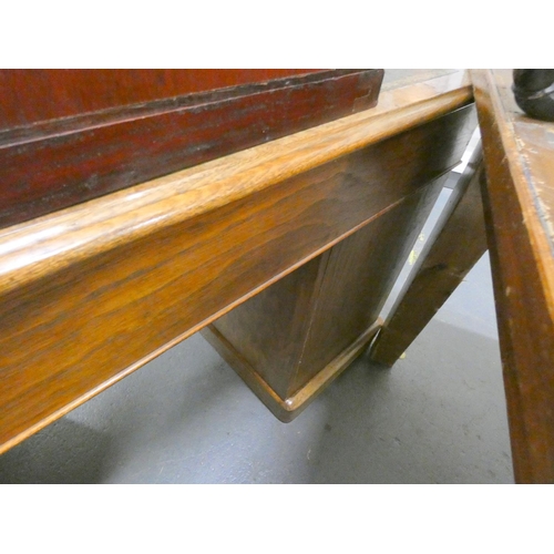 414 - Victorian walnut veneered pedestal desk with tooled leather top, the large drawer with ring handles,... 