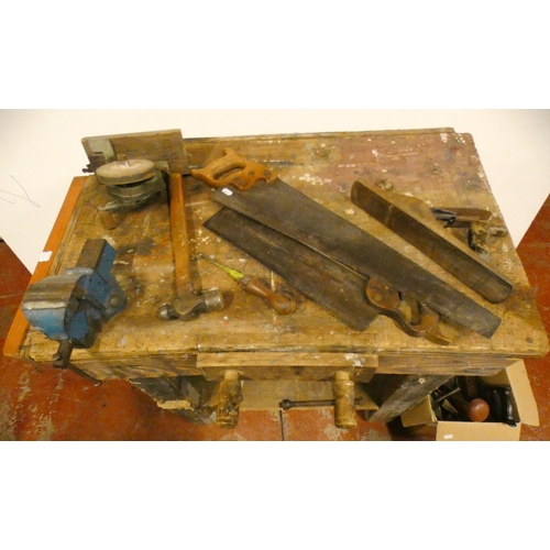 97 - Vintage pine work bench with attached metal vice, and a collection of tools to include saws, one exa... 