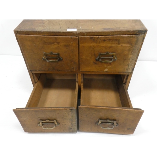 99 - Mid-century oak library index cabinet with four deep drawers, 40cm high, 51cm wide and 39.5cm deep.