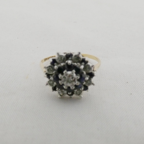 39 - 9ct gold sapphire and diamond lady's cluster ring in a flowerhead setting, with a small brilliant st... 