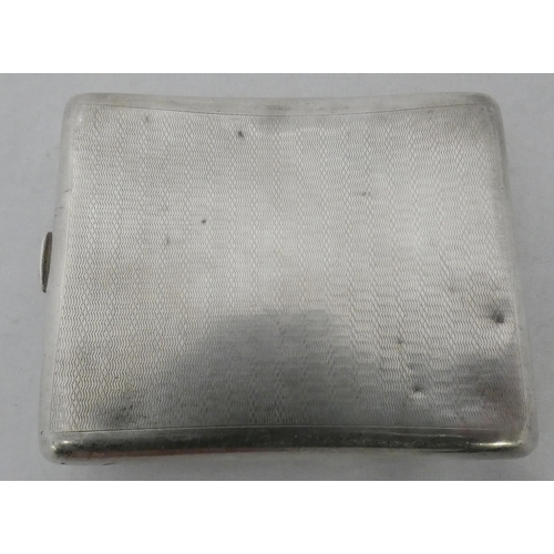 85 - Silver curved cigarette case, hallmarks for Birmingham, c. 1933, 90g.