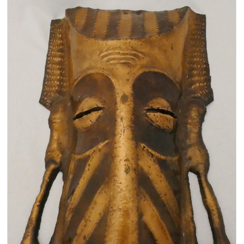 87 - African tribal copper mask, 20th century, 46cm x 19.5cm.