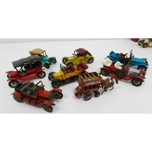 93 - Group of model scale diecast cars and buses, mainly by Lesney, to include a 1911 Ford Model T, 1907 ... 