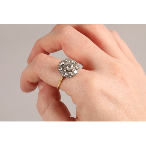 49 - Diamond cluster ring, central old cut 1 carat stone surrounded by eight 0.2 carat stones, mounted in... 