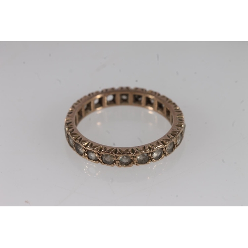 504 - 9ct gold and white stone eternity ring, 2.9g.