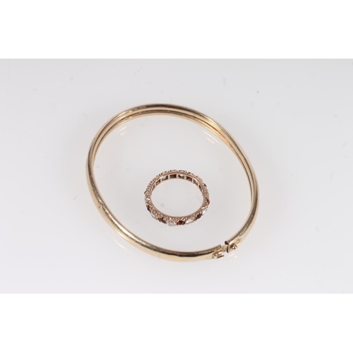 508 - Yellow metal bangle together with a yellow metal ring (2)