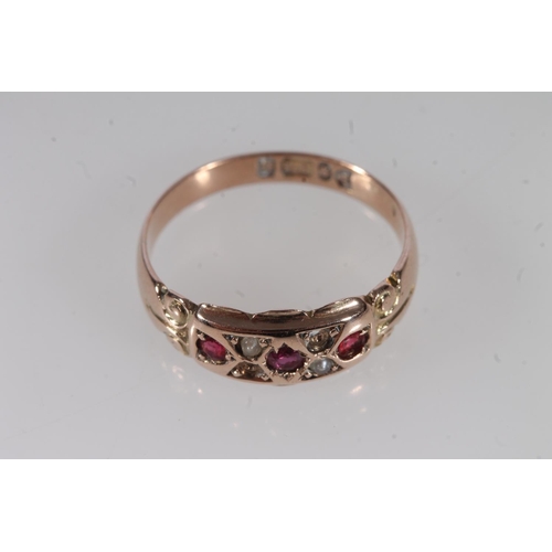 509 - 9ct gold ruby and seed pearl ring, 2.8g.