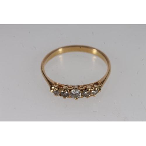 513 - Yellow metal and five stone diamond ring.