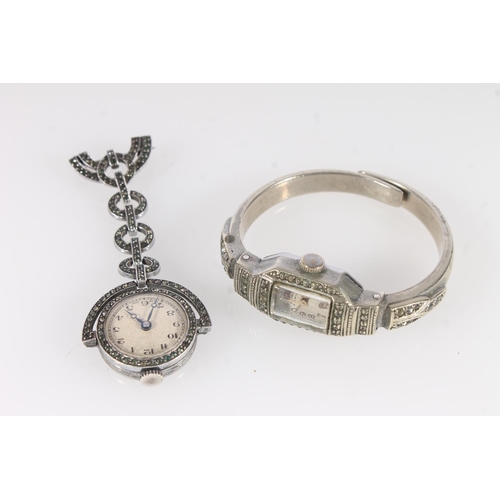 533 - Ladies cocktail bangle watch and a silver nurses fob watch (2)