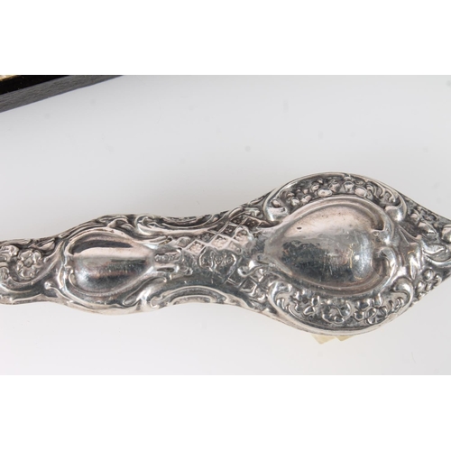 544 - Set of seven hallmarked silver coffee spoons, 51g, together with a silver handled button hook.