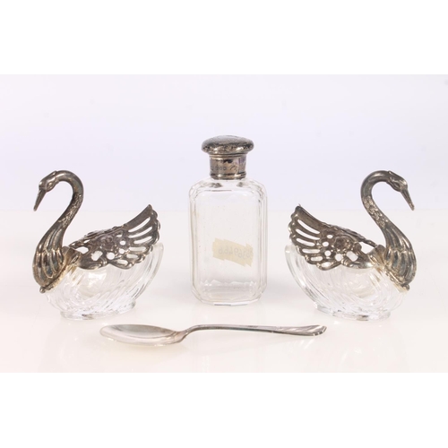 551 - Silver and glass perfume bottle, silver teaspoon and a pair of silver plated and glass Swan form sal... 