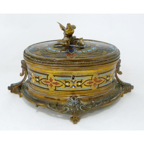 398 - French champlevé and gilt metal oval jewellery box, c. early 20th century, with bird surmount on stu... 