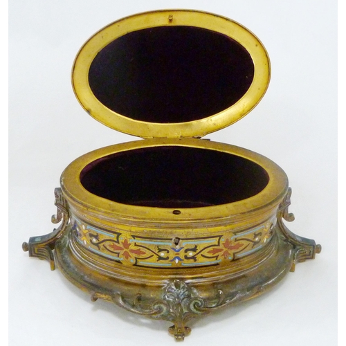 398 - French champlevé and gilt metal oval jewellery box, c. early 20th century, with bird surmount on stu... 