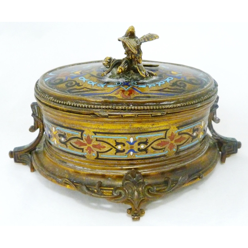 398 - French champlevé and gilt metal oval jewellery box, c. early 20th century, with bird surmount on stu... 