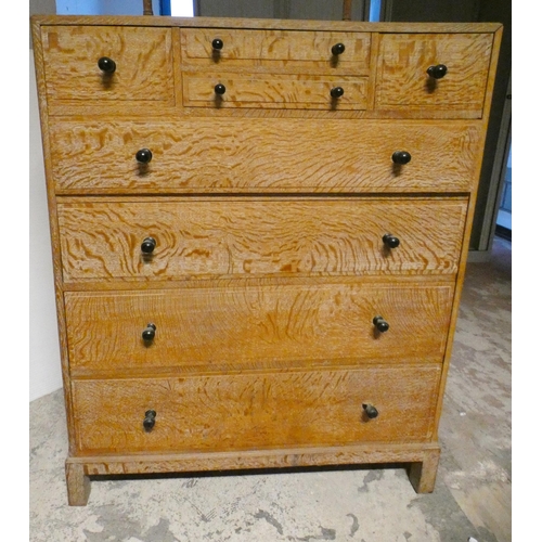 557 - Heal's of London Limed oak dressing chest with a bank of four assorted short drawers above four long... 