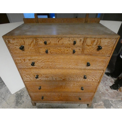 557 - Heal's of London Limed oak dressing chest with a bank of four assorted short drawers above four long... 