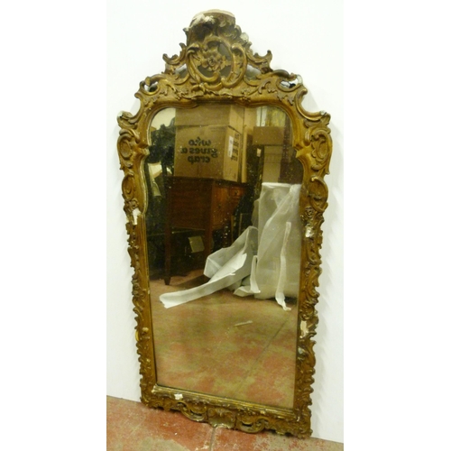 503 - Rococo-style giltwood and gesso wall mirror, 19th century, the frame with all over scrolls, plate gl... 