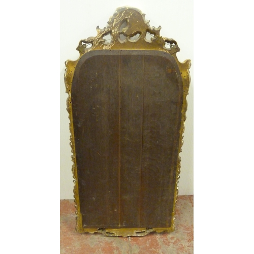 503 - Rococo-style giltwood and gesso wall mirror, 19th century, the frame with all over scrolls, plate gl... 