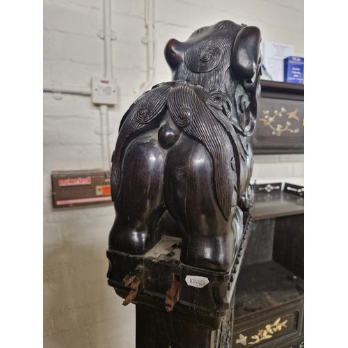 538 - Pair of carved hardwood Chinese foo dogs.128cm high