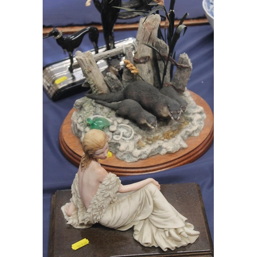 110 - House of Erte figurine, Border Fine Arts Otter group and an Italian figurine (3)