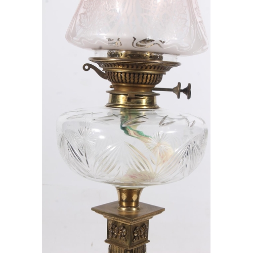 126 - Edwardian brass column oil lamp with clear font and etched shade, H75cm to top of funnel.