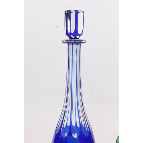 128 - Edwardian blue glass overlay cut to clear decanter and a similar period green glass enamelled jug (2... 