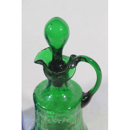 128 - Edwardian blue glass overlay cut to clear decanter and a similar period green glass enamelled jug (2... 